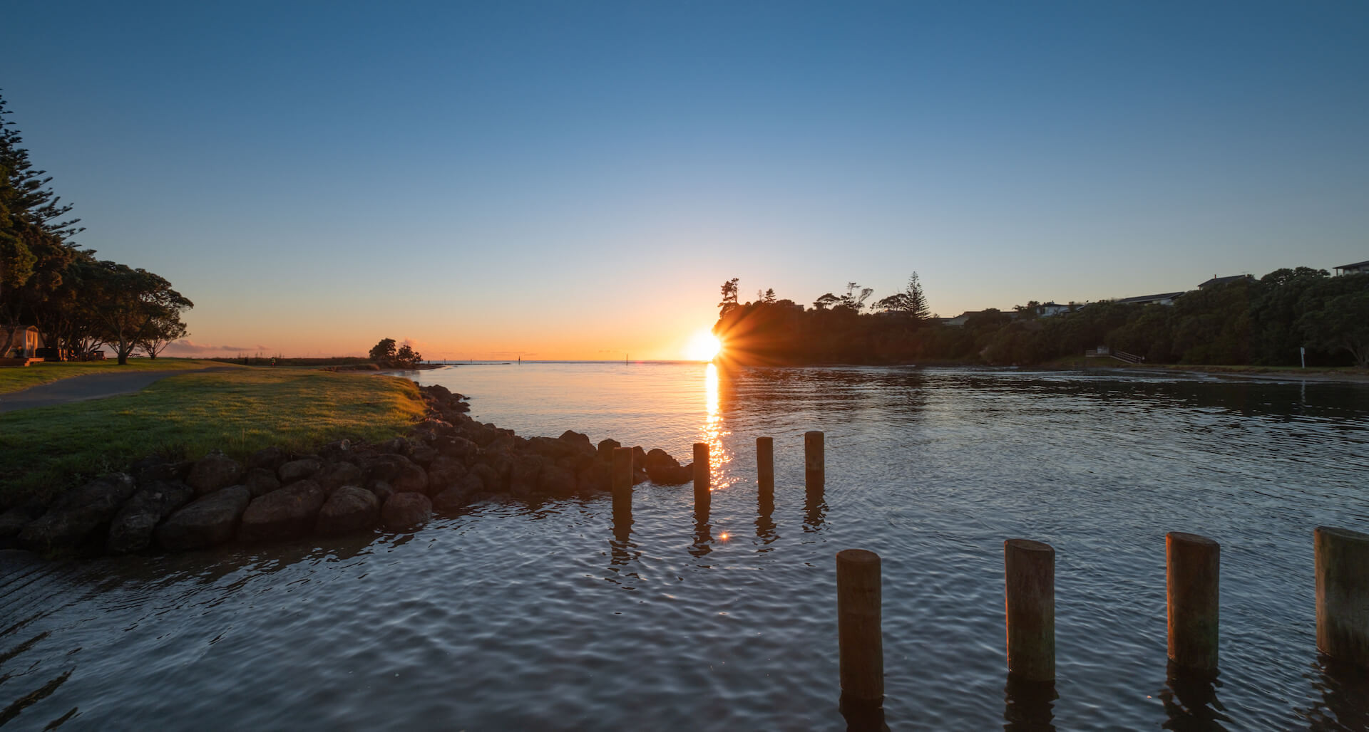 Sunrise over the calm water at Red Beach